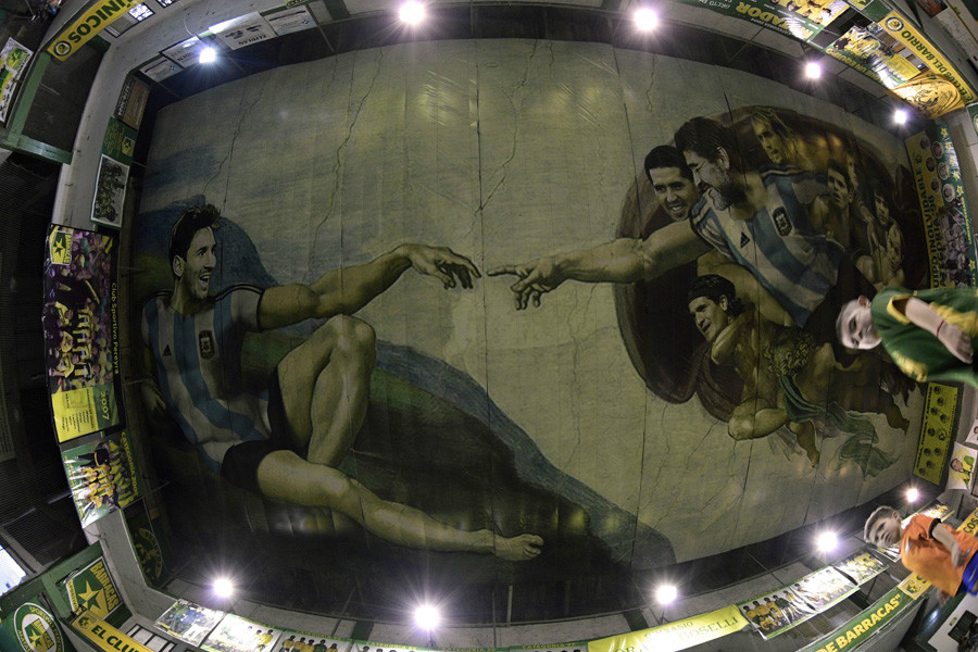 Buenos Aires artist Santiago Barbeito has painted the ceiling of the arena at the Sportivo Pereyra de Barracas club to depict a version of Michelangelo's famous'Creation of Adam'. The mural, which represents the enduring tradition of Argentine soccer, depicts Lionel Messi as'Adam' while 1986 World Cup hero Diego Maradona is 'God', surrounded by 'apostles' Sergio Aguero, Mario Kempes, Ricardo Bochini, Gabriel Batistuta, Claudio Caniggia, Juan Roman Riquelme and Ariel Ortega